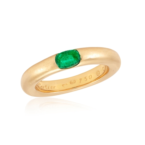 5 - AN EMERALD 'ELLIPSE' RING, BY CARTIER, 1992  The oval-shaped emerald set to a plain hoop, mounted in... 