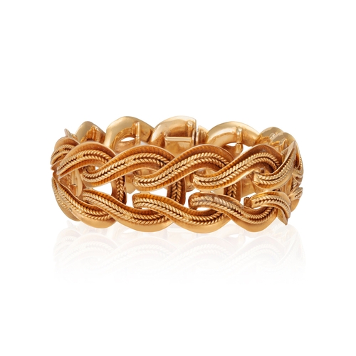 50 - A GOLD BRACELET, FRENCH, CIRCA 1955  Of openwork design, the interlinked gathered hoops with ropetwi... 