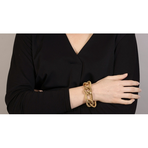 54 - A GOLD BRACELET, ITALIAN, CIRCA 1960  Composed of circular polished and brushed gold ropetwist links... 