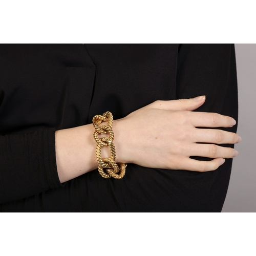 54 - A GOLD BRACELET, ITALIAN, CIRCA 1960  Composed of circular polished and brushed gold ropetwist links... 