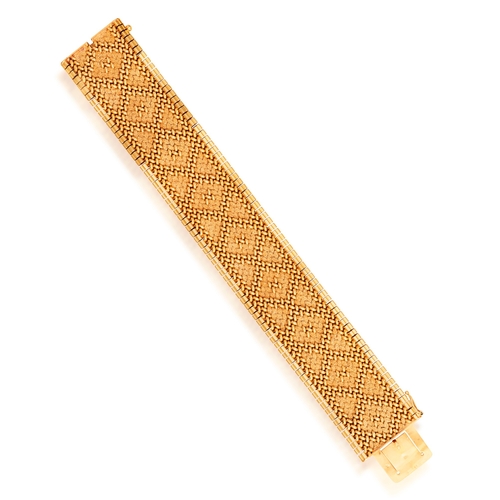 56 - A GOLD BRACELET, FRENCH, CIRCA 1965  The textured and polished strap designed to resemble embroidery... 