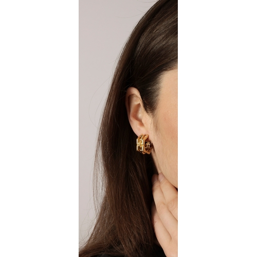 67 - A PAIR OF GOLD EARCLIPS, BY PÉRY & FILS  Each polished gold earclip with fluted detailing, mounted i... 