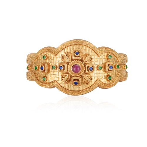 78 - A GEM-SET BANGLE, BY ILIAS LALAOUNIS  Of hinged design, the central scalloped plaque, centring a flo... 