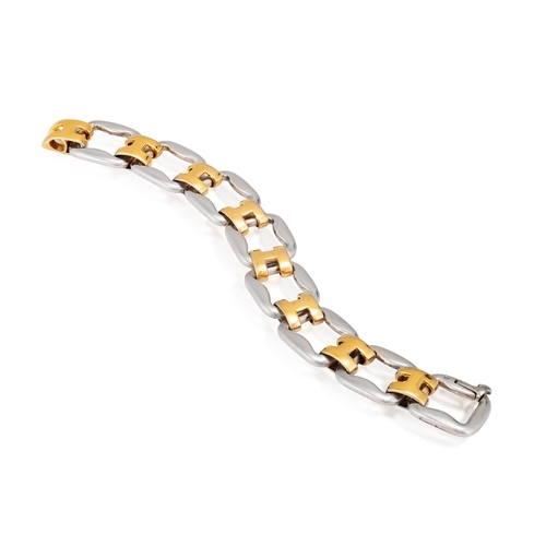 82 - A SILVER AND GOLD BRACELET, BY HERMÈS  Of openwork design, composed of polished silver links with po... 