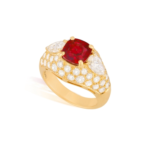 96 - A VERY FINE RUBY AND DIAMOND RING, BY BULGARI

The cushion-shaped ruby weighing 2.92cts within a fou... 