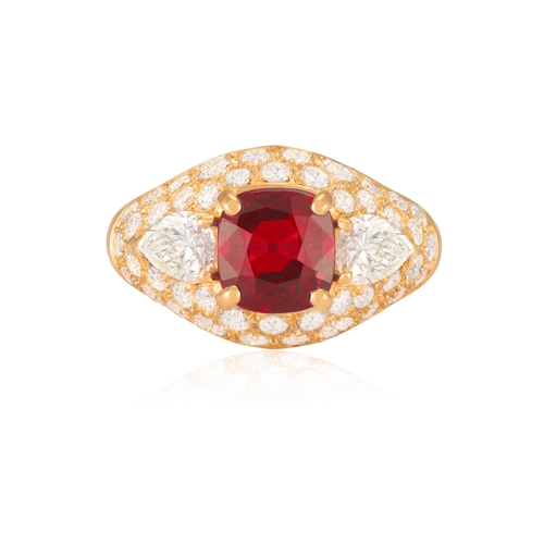 96 - A VERY FINE RUBY AND DIAMOND RING, BY BULGARI

The cushion-shaped ruby weighing 2.92cts within a fou... 