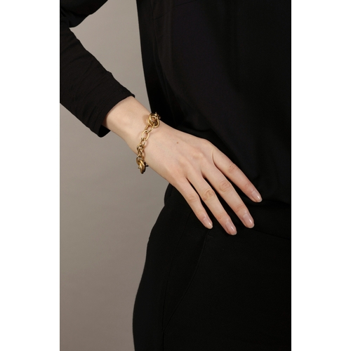 97 - A GOLD BRACELET, BY POMELLATO  The fancy polished and brushed gold links, in 18K gold, signed Pomell... 