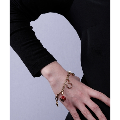 99 - A GOLD CHARM BRACELET, BY CARTIER  The belcher-link chain bracelet, suspending five detachable charm... 