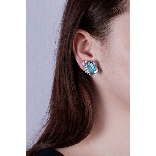 45 - A PAIR OF AQUAMARINE AND DIAMOND EARCLIPS  Each set with a rectangular-cut aquamarine, each weighing... 