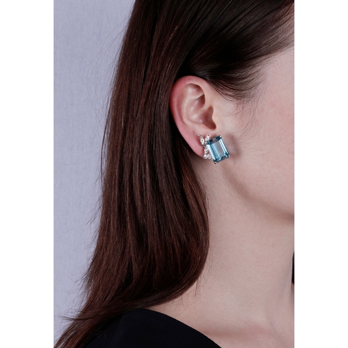 45 - A PAIR OF AQUAMARINE AND DIAMOND EARCLIPS  Each set with a rectangular-cut aquamarine, each weighing... 