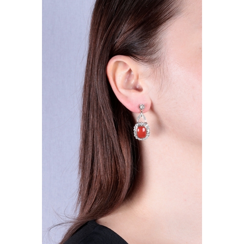 55 - A PAIR OF MID 20TH CENTURY CORAL AND DIAMOND EARRINGS  Each set with a cushion-shaped cabochon coral... 