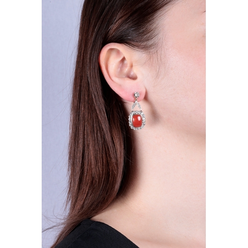 55 - A PAIR OF MID 20TH CENTURY CORAL AND DIAMOND EARRINGS  Each set with a cushion-shaped cabochon coral... 