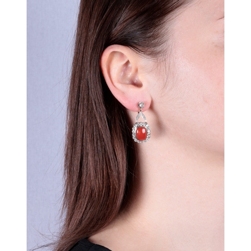 55 - A PAIR OF MID 20TH CENTURY CORAL AND DIAMOND EARRINGS  Each set with a cushion-shaped cabochon coral... 