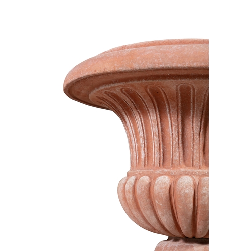 10 - AN ITALIAN 'POGGI UGO' TERRACOTTA GARDEN URN,  on pedestal base, 50cm high.