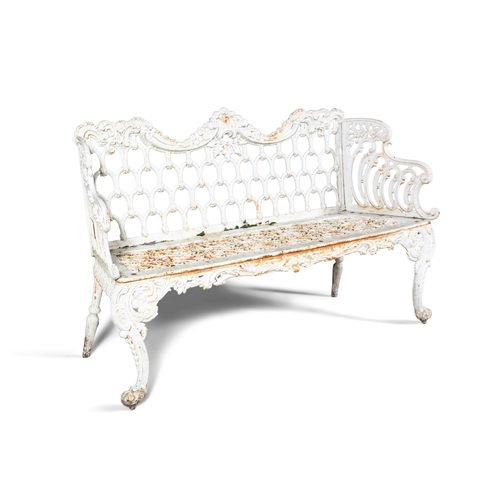 14 - A VICTORIAN WHITE PAINTED CAST IRON GARDEN BENCH   the arched foliate top rail above openwork back, ... 