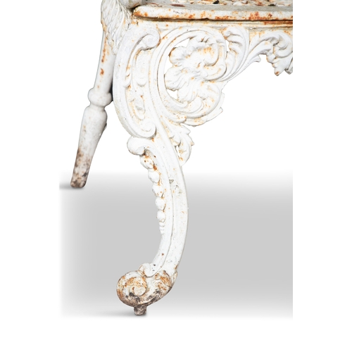 14 - A VICTORIAN WHITE PAINTED CAST IRON GARDEN BENCH   the arched foliate top rail above openwork back, ... 