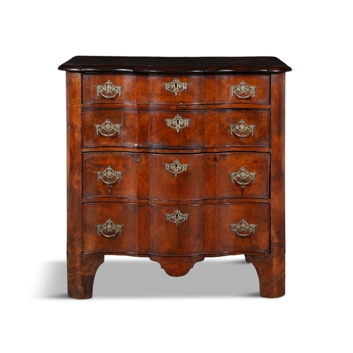 33 - A DUTCH SERPENTINE FRONT CHEST OF DRAWERS   the plain top above a four long drawers with brass drop ... 