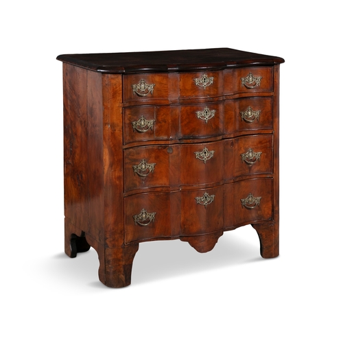 33 - A DUTCH SERPENTINE FRONT CHEST OF DRAWERS   the plain top above a four long drawers with brass drop ... 