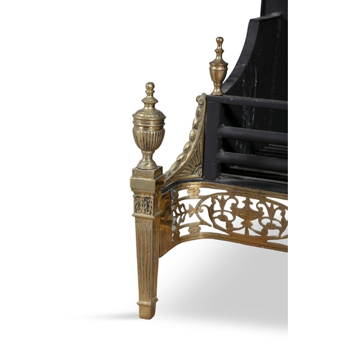 40 - A GEORGE III STYLE BRASS AND CAST IRON FIRE GRATE,   of neo-classical design, with arched backplate ... 