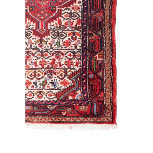 52 - AN IRANIAN RUNNER, 275 x 82cm  the central field woven with three diamond lozenges, in red tones, ag... 