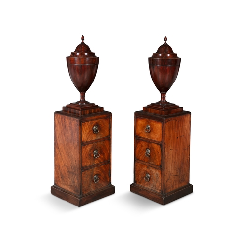 55 - A PAIR OF GEORGE III MAHOGANY DINING ROOM URNS ON PEDESTALS, c. 1800,   each with domed fluted cover... 