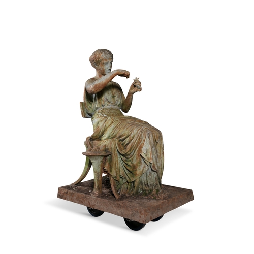 7 - A VICTORIAN CAST IRON FIGURE OF A CLASSICAL LADY,   seated on a klismos chair, holding a starfish, o... 