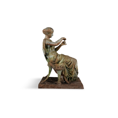 7 - A VICTORIAN CAST IRON FIGURE OF A CLASSICAL LADY,   seated on a klismos chair, holding a starfish, o... 