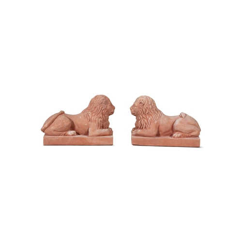 8 - A PAIR OF ITALIAN 'POGGI UGO' TERRACOTTA LIONS,  in recumbent position, on rectangular plinth base, ... 