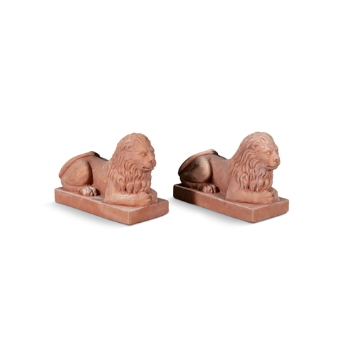 8 - A PAIR OF ITALIAN 'POGGI UGO' TERRACOTTA LIONS,  in recumbent position, on rectangular plinth base, ... 