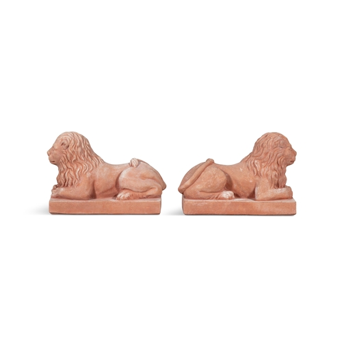 8 - A PAIR OF ITALIAN 'POGGI UGO' TERRACOTTA LIONS,  in recumbent position, on rectangular plinth base, ... 