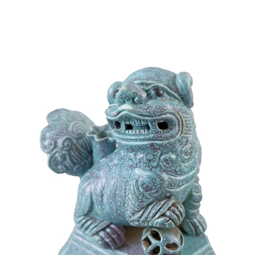 138 - A PAIR OF ROBIN'S EGG-GLAZED BUDDHISTIC LION INCENSE HOLDERS  民国 炉均釉獅子瓷塑香插一對  China, Republic period... 