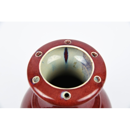 144 - A FLAMBÉ RED-GLAZED ‘WU KONG PING’ VASE  民國 窯變紅釉五孔瓶  China, Republic period.   Of baluster form, cov... 