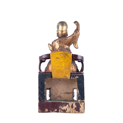 152 - A GILT AND POLYCHROME PAINTED TAOIST GUARDIAN SEATED FIGURE  清早 木泥金彩繪道教護法坐像  China, early Qing dynas... 