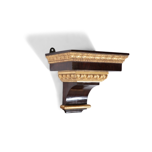 28 - A SMALL WALNUT AND PARCEL GILT RECTANGULR WALL BRACKET,   29cm wide, 26cm high, 20cm deep.