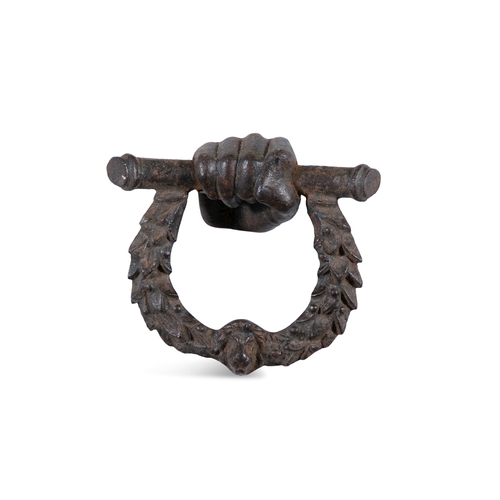 29 - A 19TH CENTURY CAST IRON DOOR KNOCKER,   formed as a clenched hand suspending a laurel wreath with l... 