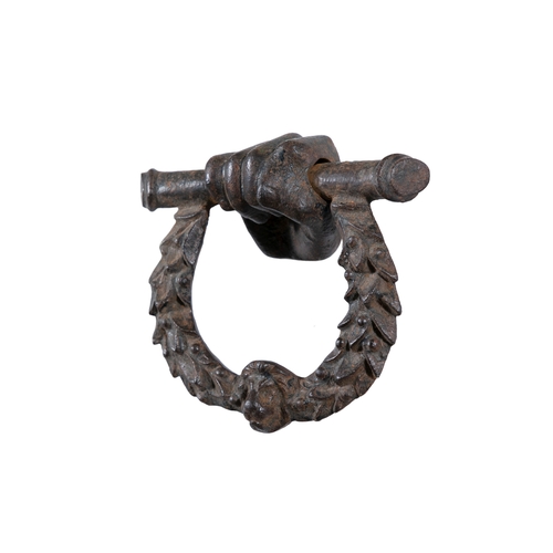 29 - A 19TH CENTURY CAST IRON DOOR KNOCKER,   formed as a clenched hand suspending a laurel wreath with l... 