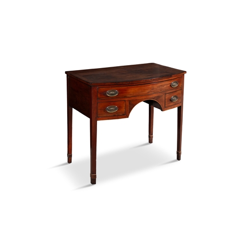 327 - A GEORGE III INLAID MAHOGANY BOWFRONT KNEEHOLE WRITING TABLE   fitted one long and two short drawers... 