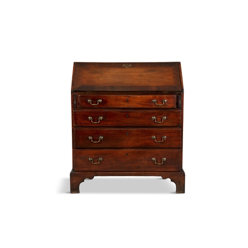 330 - A GEORGE III MAHOGANY SLOPE FRONT BUREAU   the crossbanded sloped front panel enclosing a tooled lea... 