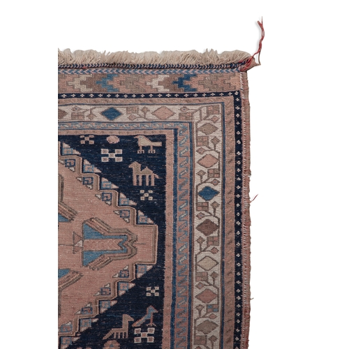 35 - A PINK GROUND WOOL RUG. 216CM LONG, 152CM WIDE   the centre field woven with six interlinking diamon... 