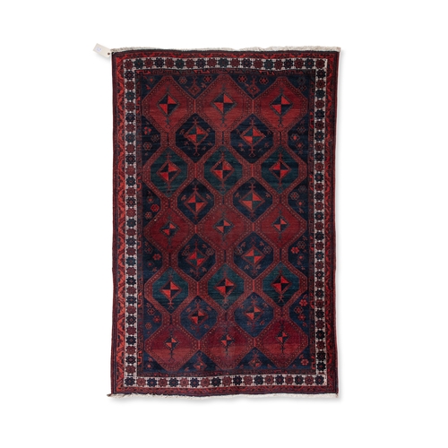 37 - AN AFGHAN RED GROUND WOOL RUG. 235CM LONG, 147CM WIDE   the central field woven with a series of int... 