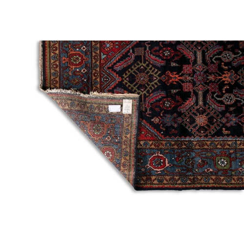 38 - A BLUE AND RED GROUND WOOL RUG 210CM LONG, 130CM WIDE   with central lozenge against a navy ground d... 