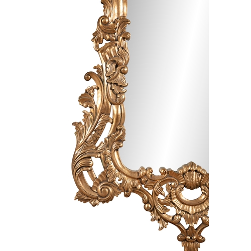 51 - A LARGE VICTORIAN STYLE GILTWOOD WALL MIRROR,   20th century, fitted with shaped rectangular plate, ... 