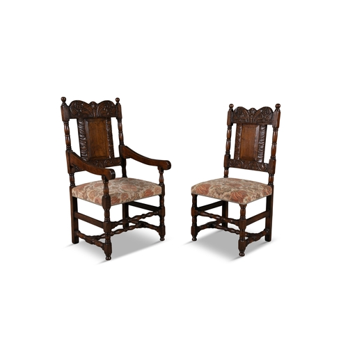 66 - TWO 17TH CENTURY STYLE CARVED OAK ARMCHAIRS   the shaped rectangular backs with floral scroll work c... 