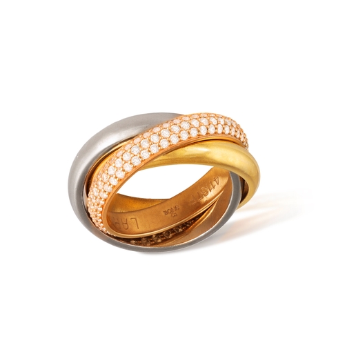 1 - CARTIER: A DIAMOND TRINITY RING  Composed of three interlocking polished bands of yellow, white and ... 