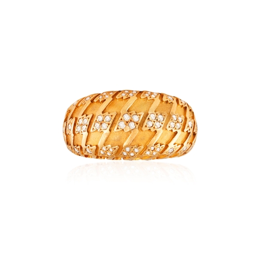 103 - DIOR: A DIAMOND DRESS RING  Of bombé design, embellished with brushed gold motifs accented with bril... 