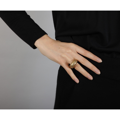 103 - DIOR: A DIAMOND DRESS RING  Of bombé design, embellished with brushed gold motifs accented with bril... 