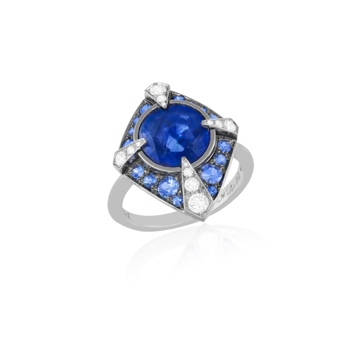 108 - LANGI: A SAPPHIRE AND DIAMOND DRESS RING  The oval brilliant step-cut sapphire weighing 2.92cts with... 