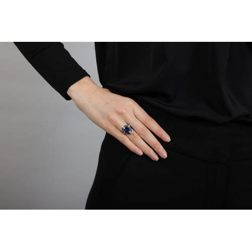 108 - LANGI: A SAPPHIRE AND DIAMOND DRESS RING  The oval brilliant step-cut sapphire weighing 2.92cts with... 