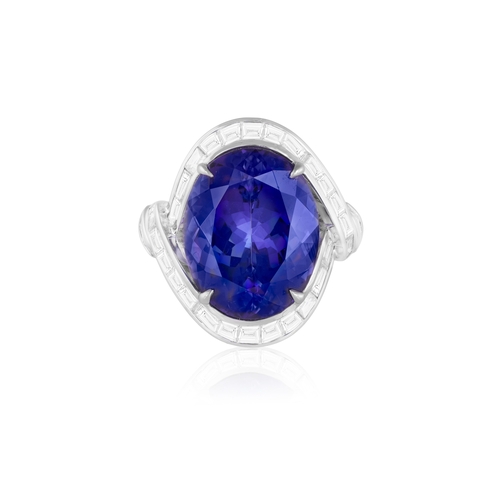 111 - A TANZANITE AND DIAMOND DRESS RING  The oval-shaped tanzanite weighing approximately 14.50cts within... 