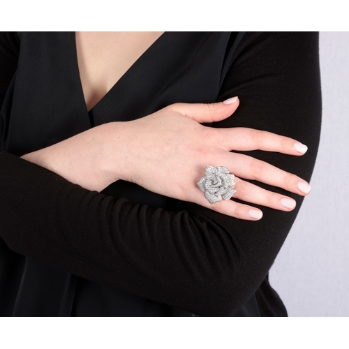 124 - JOVADI: A DIAMOND 'WHITE ROSE' COCKTAIL RING  Designed as a stylised rose flowerhead, pavé-set with ... 